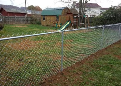 chain link fence in a back yard